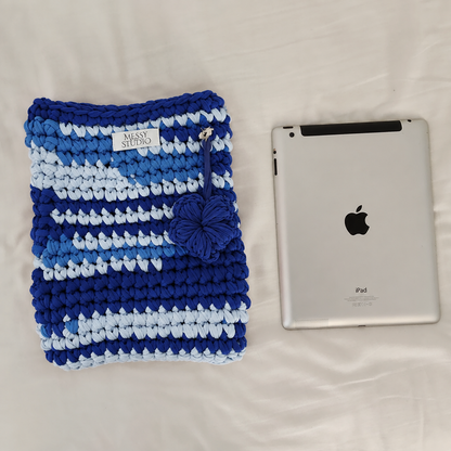 Blue sleeve beside tablet